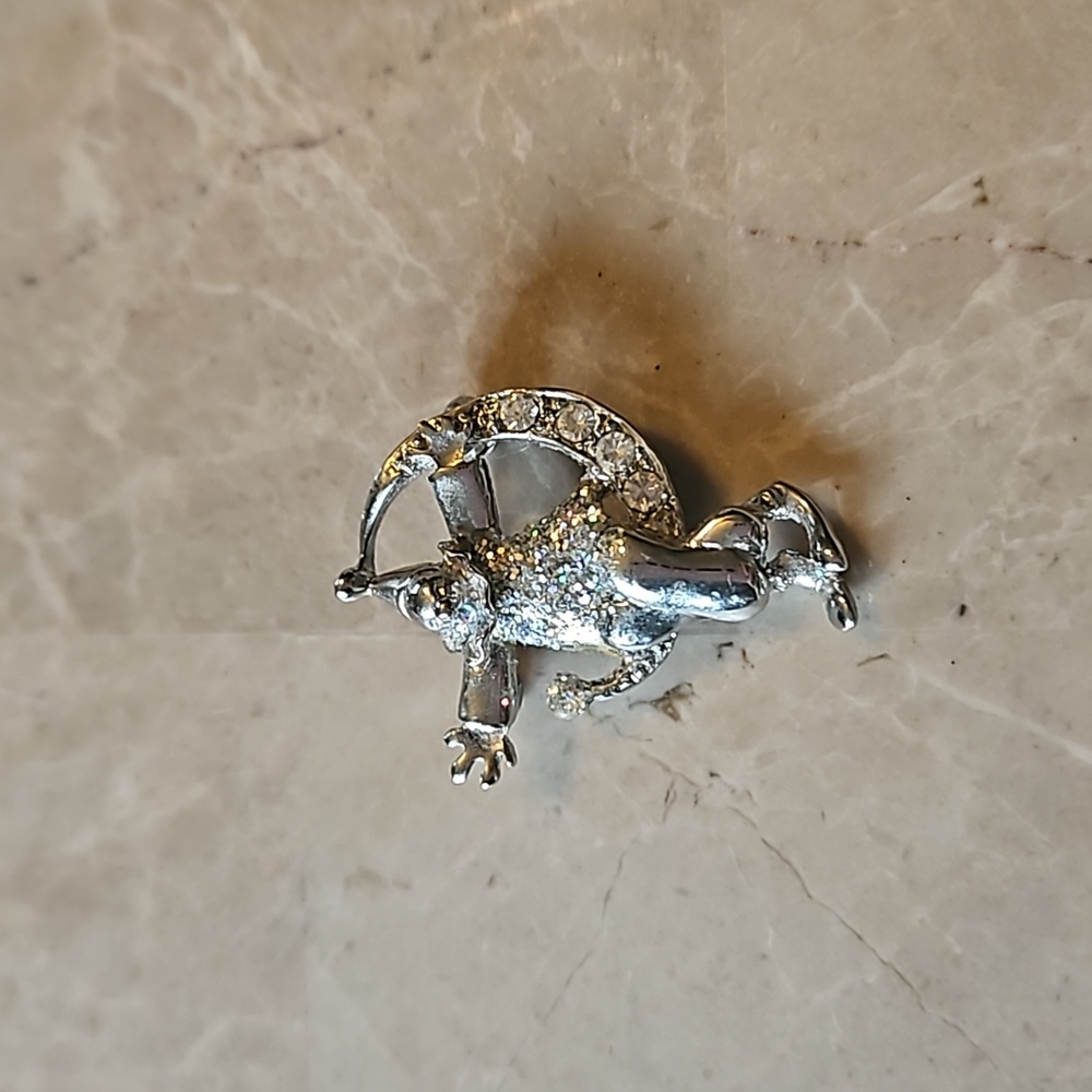 Vintage clown sitting in Cresent moon adorned with rhinestones brooch
